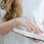Woman Reads Anxiety Calming Scripture