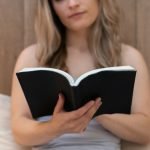 Woman Reads Anxiety Calming Scripture