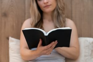 Woman Reads Anxiety Calming Scripture
